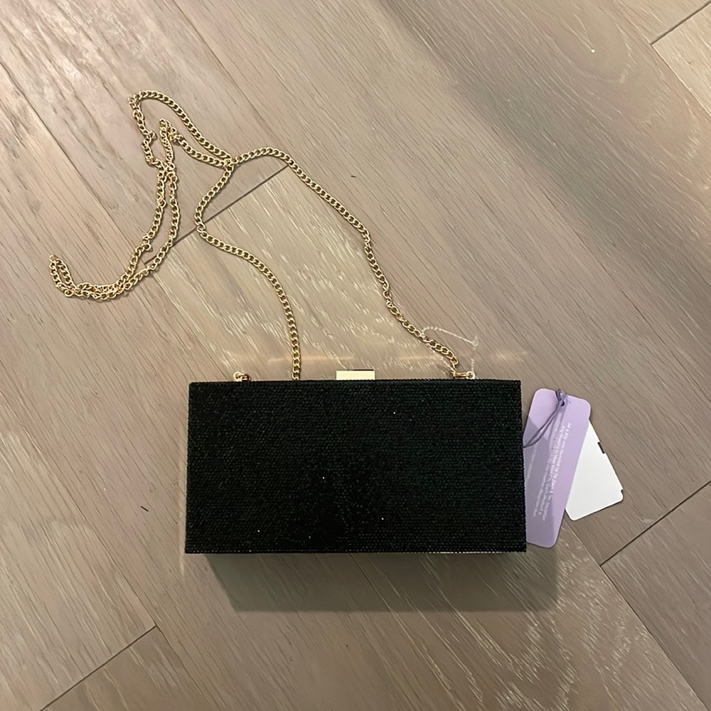 NWT black rhinestone rectangular clutch with gold chain. Brand is: Jill & Ally